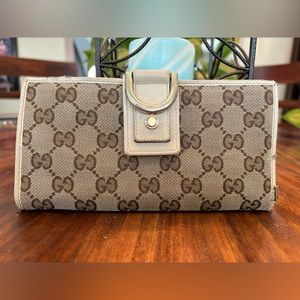 Guccu Wallet Long GG Abby cream bifold. Used condition  one snap not so snappy